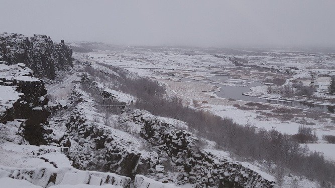 Adventurous travelers exploring Iceland waterfalls