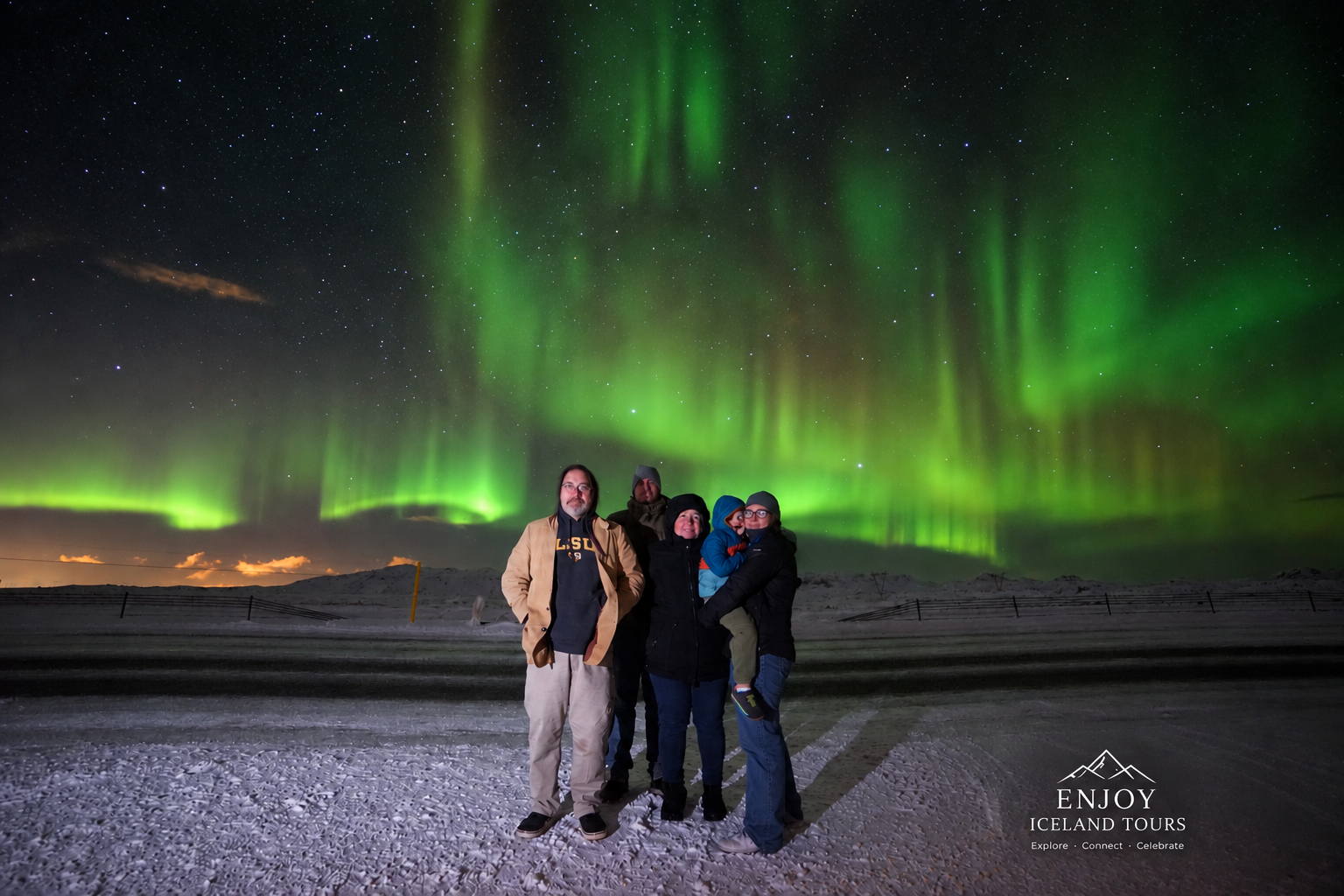 Family enjoying a private Northern Lights tour in Iceland