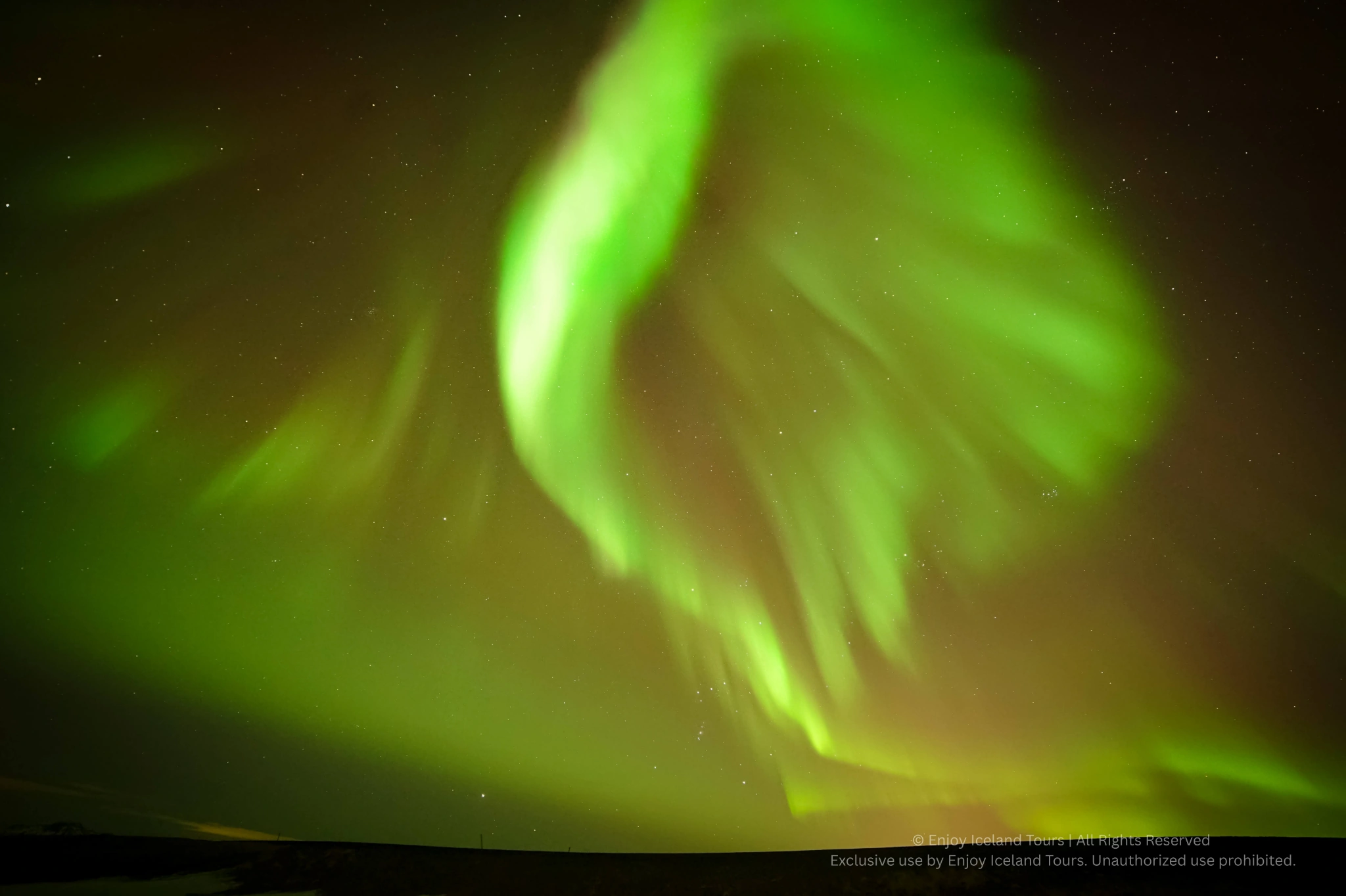 Aurora Borealis glowing over the Icelandic night sky
