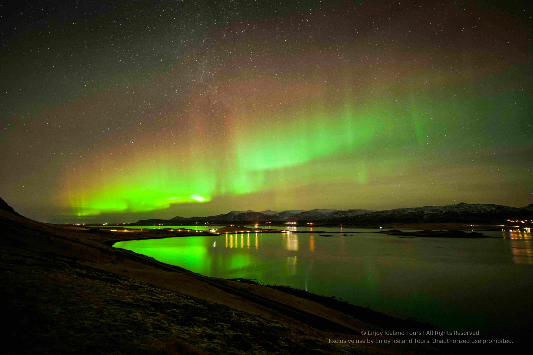 Couple enjoying a private Northern Lights tour in Iceland