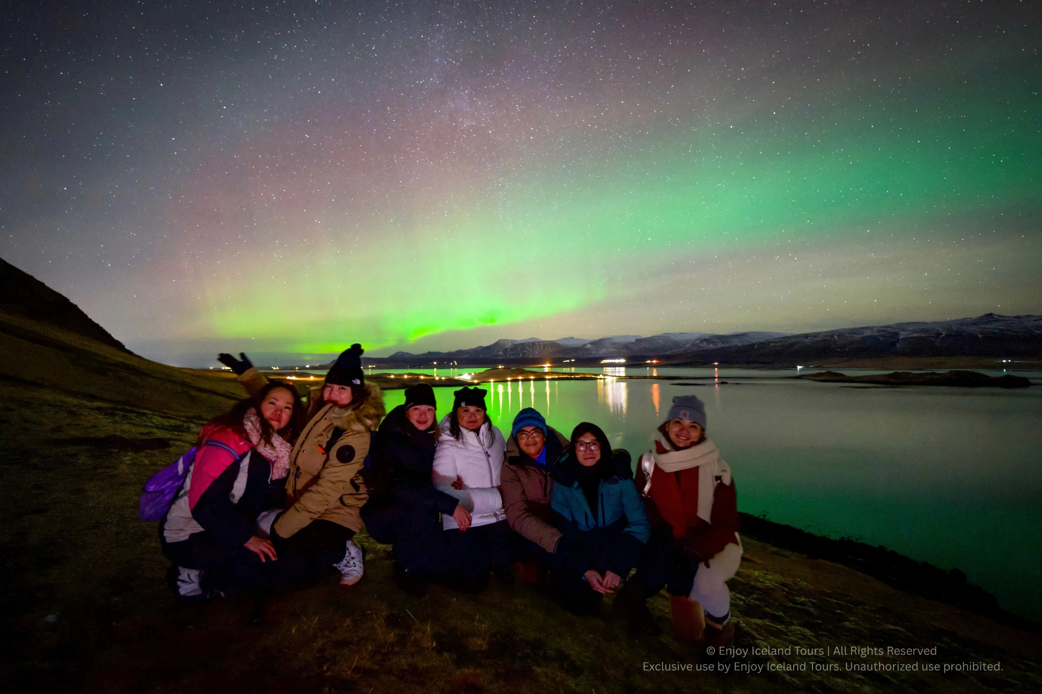 Small group enjoying a private Northern Lights tour in Iceland