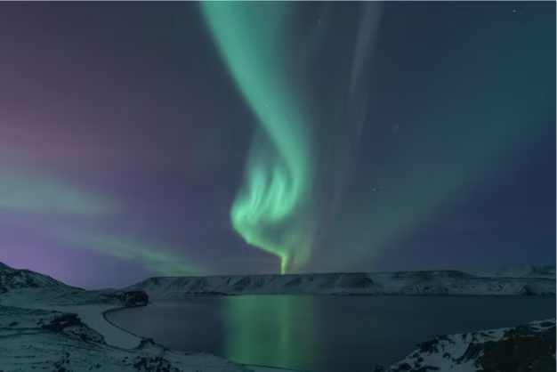 Aurora Borealis reflecting in Icelandic glacier lagoon