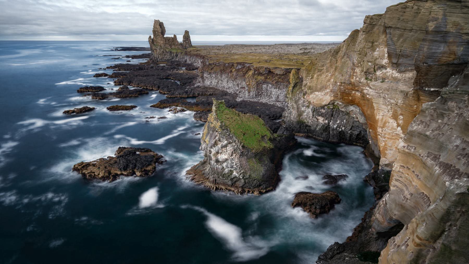 Couple enjoying northern lights during private tour in Iceland